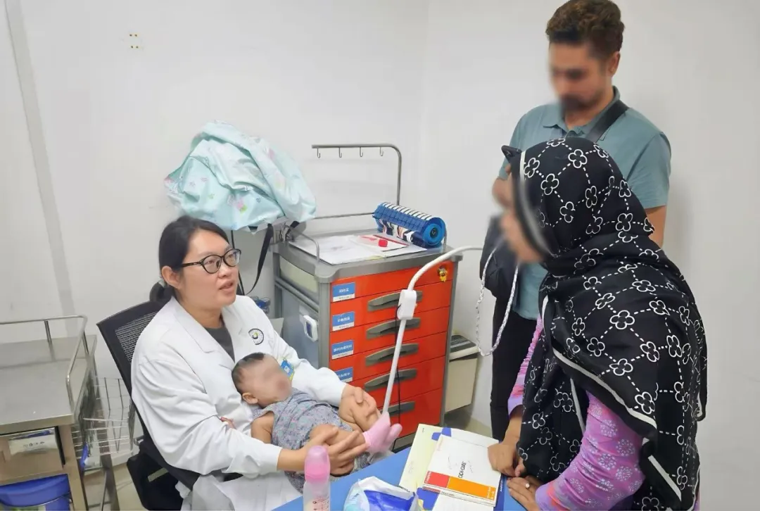 Doctor explaining treatment details to the international family