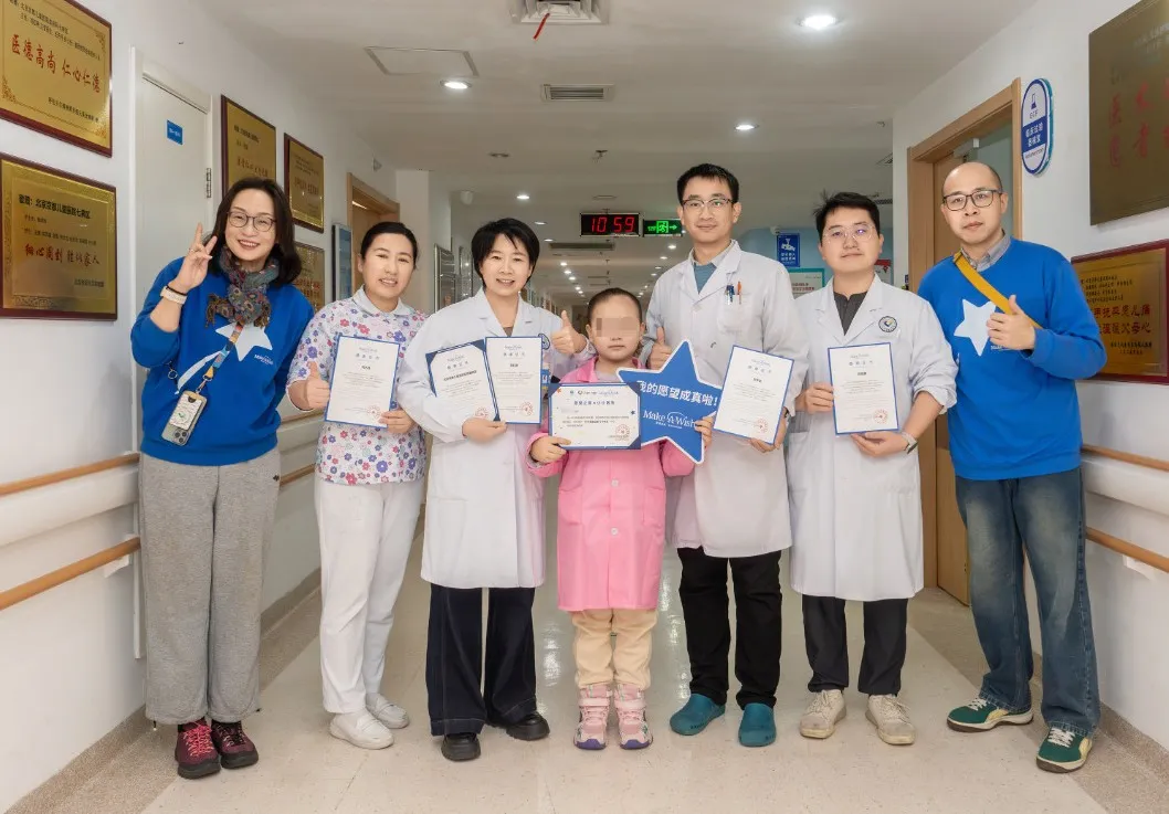 Qiqi and the medical team celebrate her Make-A-Wish Doctor Experience Day together