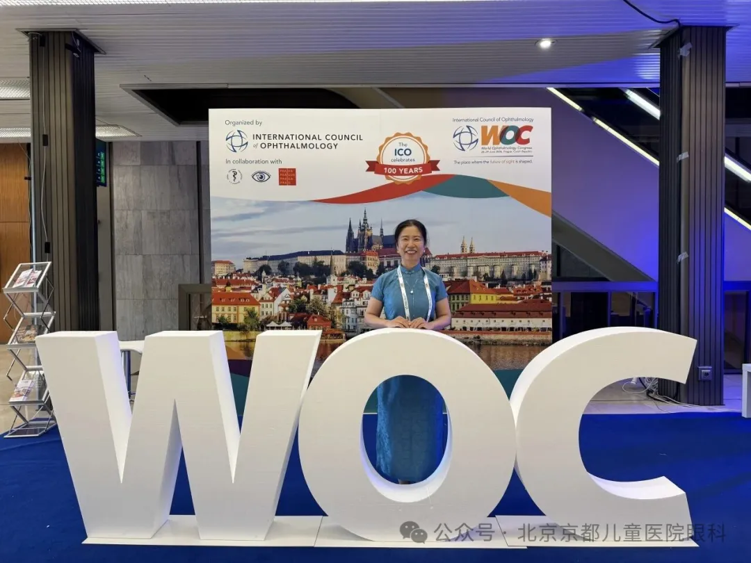 Dr. Liang Tianwei at the WOC 2026 sign
